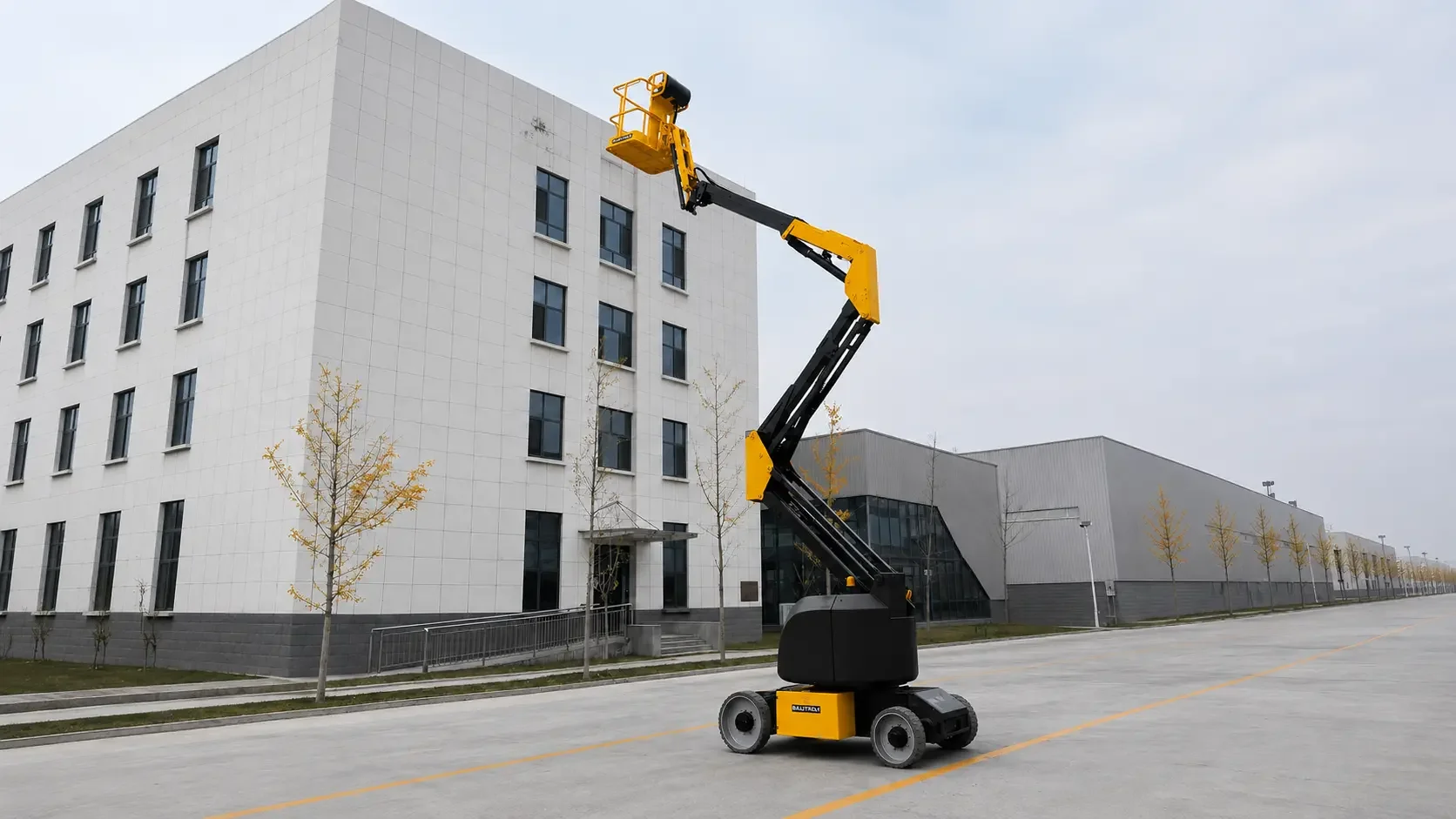 BAUTRAX AL1415 electric articulating boom lift working at height against a building