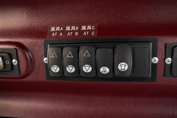 Control button panel detail for operating auxiliary functions on the CDM312 loader.