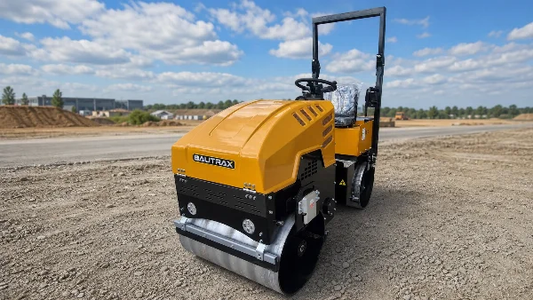 Bautrax DR10 front-right view on prepared road base with steel drum contact visible.