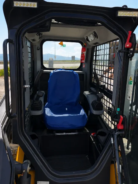 XCMG XC7-SR08 cabin entry view showing operator seat, joysticks, lights and protective side mesh.