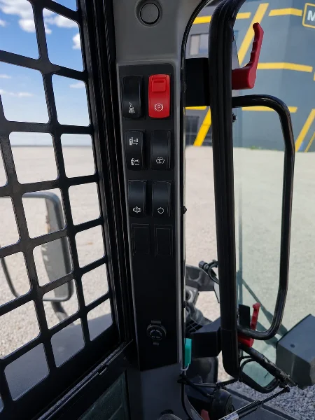 XCMG XC7-SR08 cabin switch panel with control buttons, parking brake switch and safety mesh.