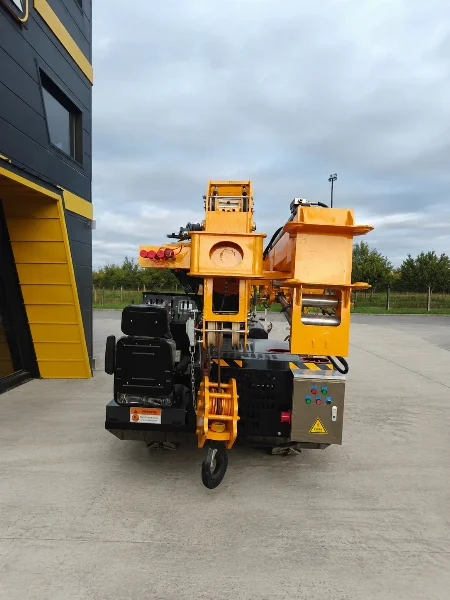 BAUTRAX SPC50 spider crane rear view showing the engine and operator control panel, parked in an industrial yard